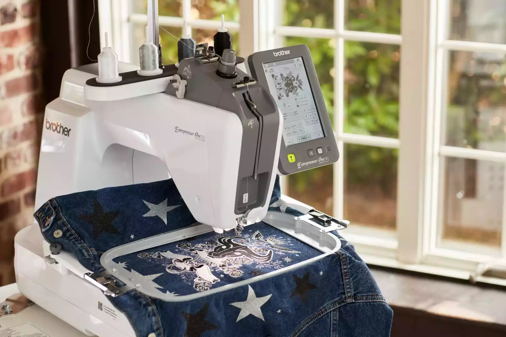 Brother PR1X embroidery machine embroidering on denim jacket