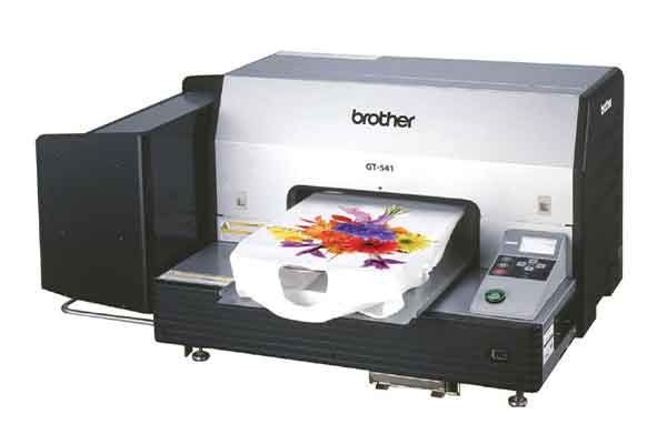 Front view of a Brother GT 541 printer with a finished shirt 