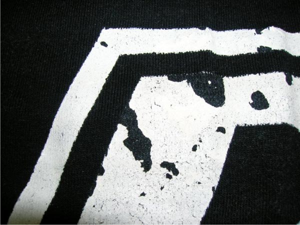 Peeling white design on black shirt 